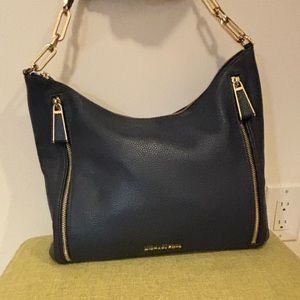 Michael Kors ladies leather mid size handbag.